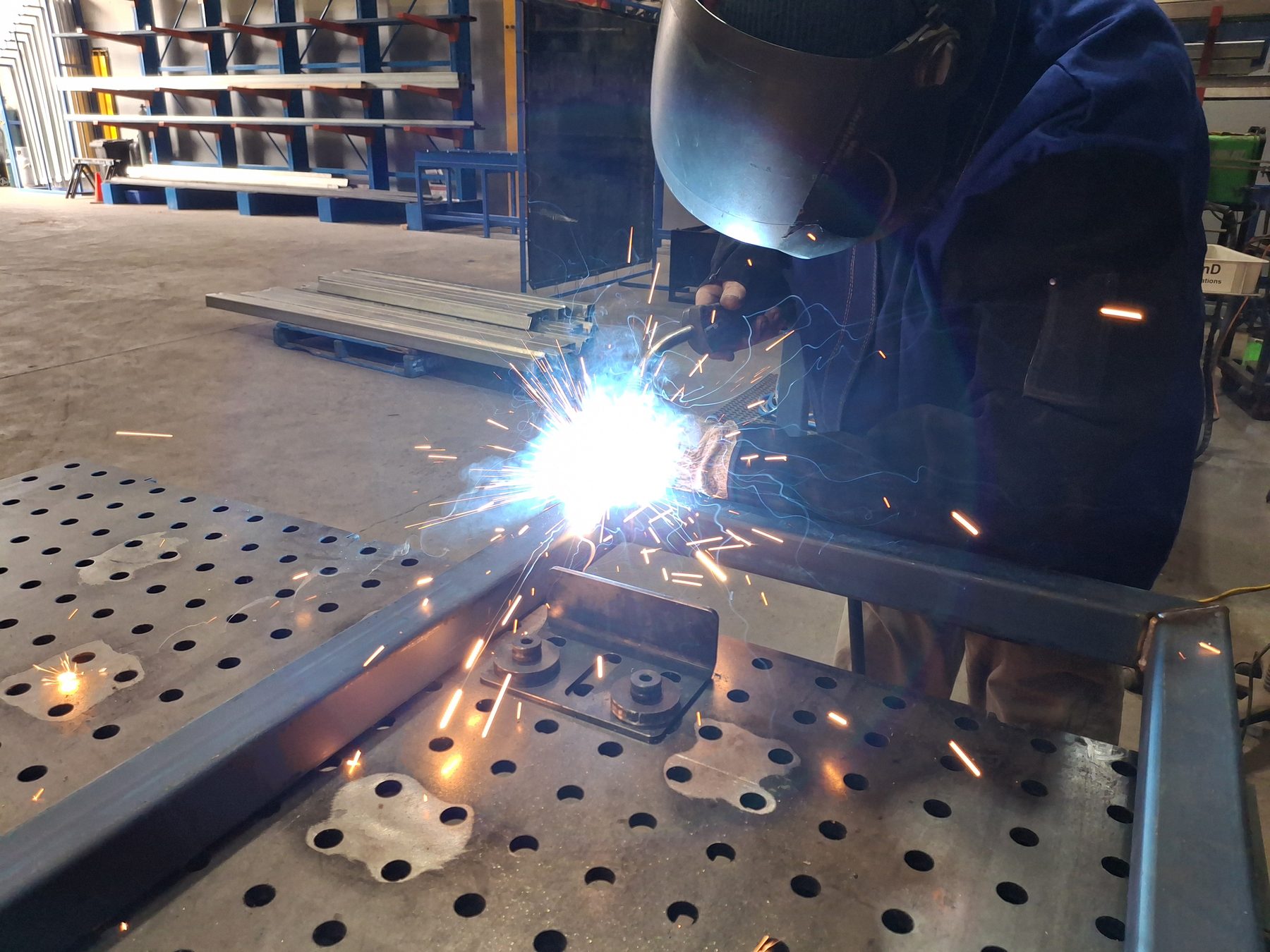 Welding in action with sparks in the workshop